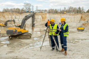 male-female-surveyors-uniform-working-construction-site